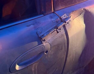 A garden gate latch was holding this car door closed.