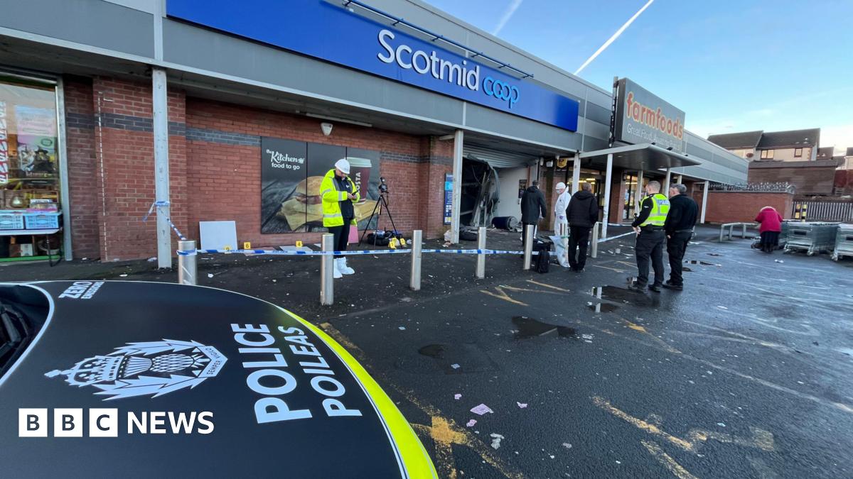 Police officers at the scene of the first attempted ATM robbery in Glasgow