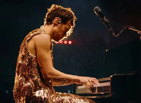 Harry Styles / Columbia Records Harry Styles in concert, as pictured in his video Forever Forever