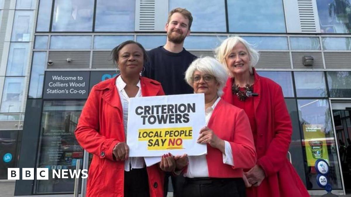 Colliers Wood's Labour Councillors and Mitcham and Morden MP Dame Siobhain McDonagh (right) outside Britannia Point. Three wear road coats and one man wears black. The sign says "Criterion Towers Local People Say No".