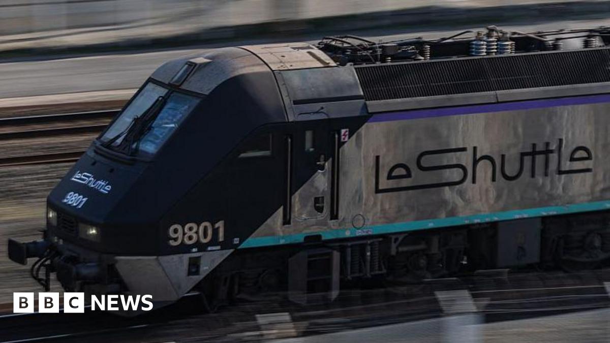 A silver train with "LeShuttle" written on the side.