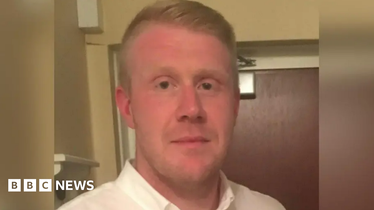 Close up image of Mr Cahalane. He is wearing a white shirt and is looking into the camera.