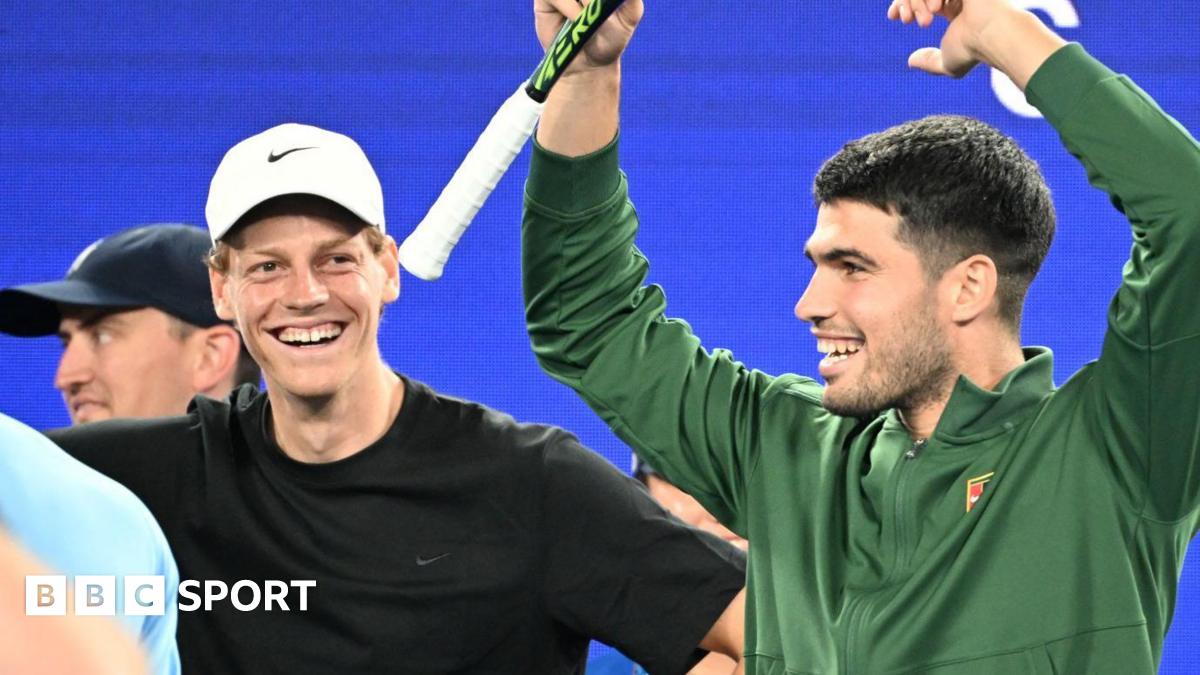 Jannik Sinner and Carlos Alcaraz laugh during the Australian Open's One Point Slam event