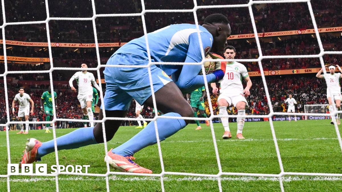 Senegal goalkeeper Eduoard Mendy catches Morocco's Brahim Diaz's Panenka penalty in Africa Cup of Nations final
