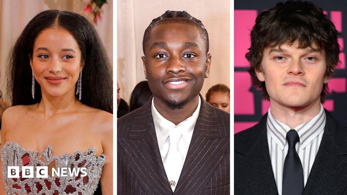 Prime Minister Mark Carney, wearing a black suit jacket, and a white button-up shirt leans his chin on his hands. He has short grey and black hair and is looking away from the camera.