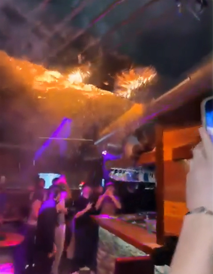 People inside a ski resort bar with towering flames on the ceiling during the fire that claimed 40 lives in Switzerland. People inside a ski resort bar with towering flames on the ceiling during the fire that claimed 40 lives in Switzerland.