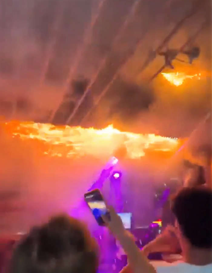 Fire engulfing ceiling at Swiss ski resort with people capturing the blaze, related to waitress allegedly starting deadly fire. Fire engulfing ceiling at Swiss ski resort with people capturing the blaze, related to waitress allegedly starting deadly fire.