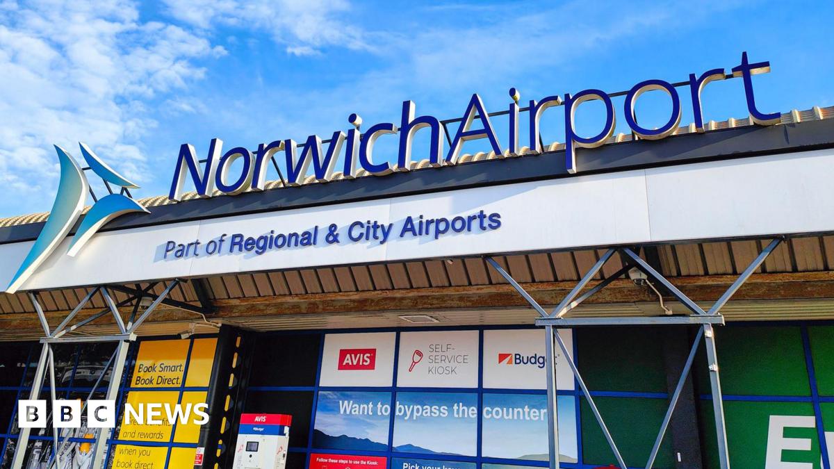 A sign saying 'Norwich Airport. Part of Regional and City Airports'
