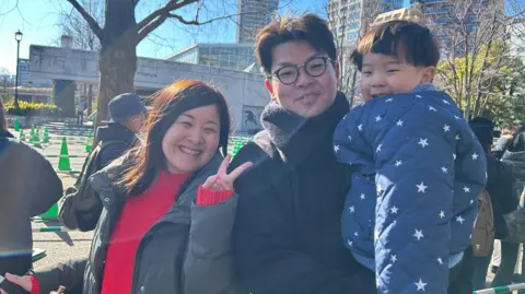 Ai Shirakawa (left), with her husband and son at the Ueno zoo on Sunday