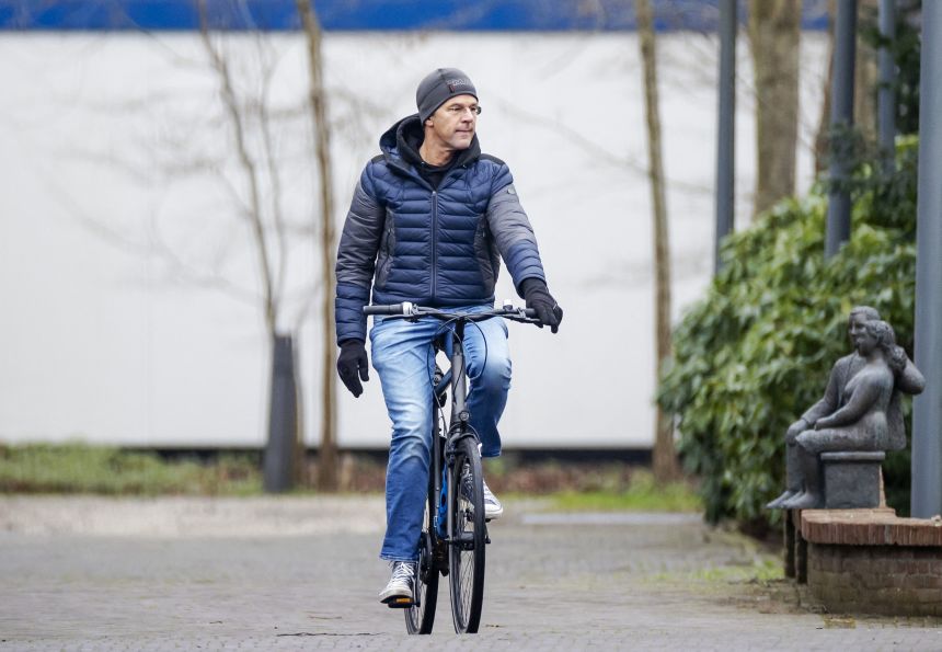 Then-Dutch Prime Minister Mark Rutte arrives on his bicycle at his official residence in The Hague on January 10, 2021.