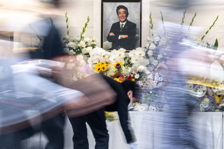 People pay their respects during a memorial service on the first death anniversary of Shinzo Abe, at Zojoji Temple in Tokyo on July 8, 2023.