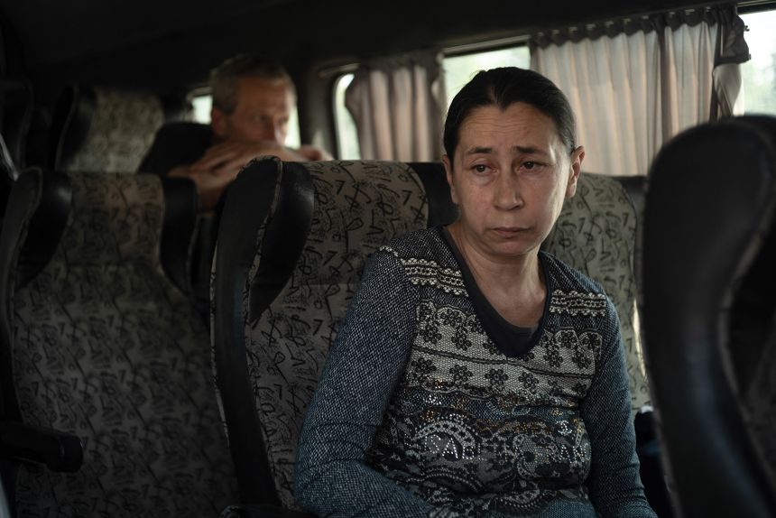 A woman from Konstyantinivka waits in a bus to be evacuated further west in the Donetsk region in eastern Ukraine, on June 2, 2025.