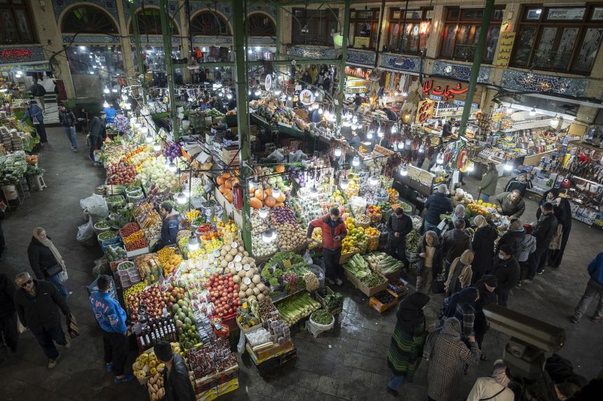 Iranian people shop for fruits and vegetables in the Tajrish Bazaar in northern Tehran, Iran, on December 31.