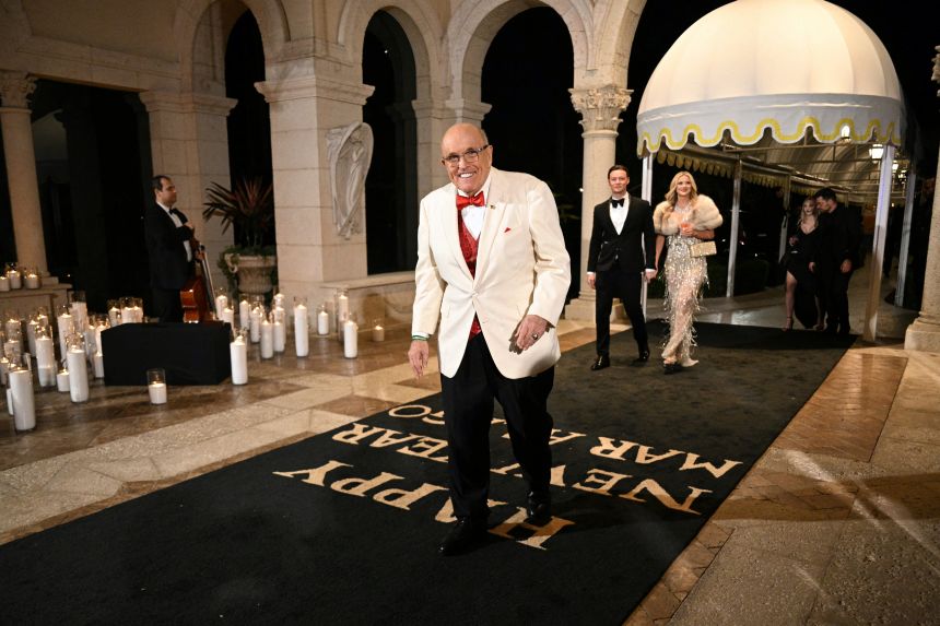 Rudy Giuliani arrives to the New Year's Eve Party hosted by US President Donald Trump at his Mar-a-Lago residence in Palm Beach, Florida, on December 31, 2025.