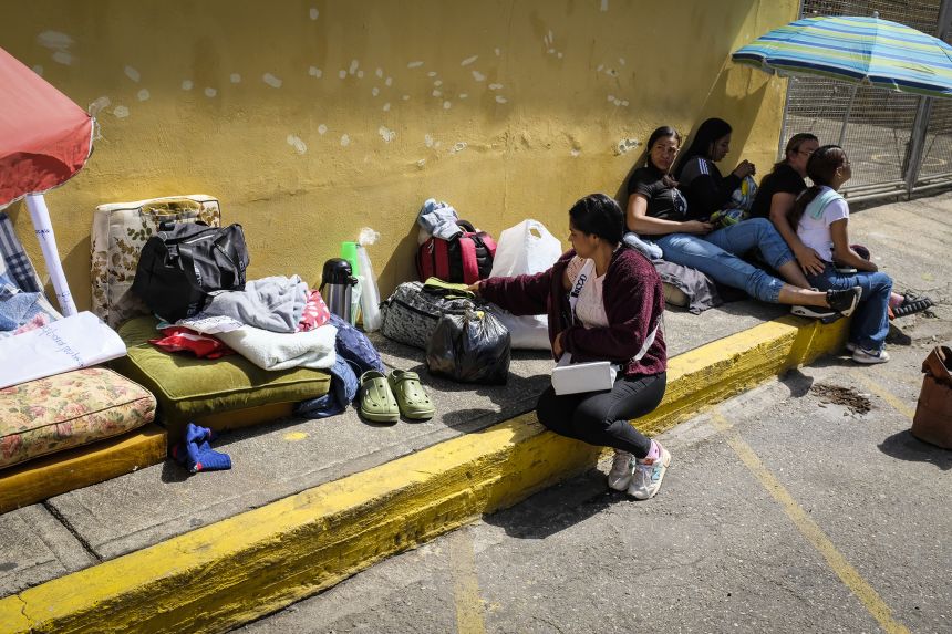 A group of women wait outside La Boleita Detention Center for the release of political prisoners  in Caracas on Monday.
