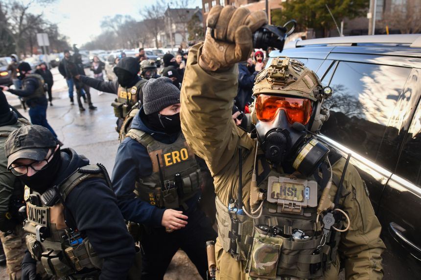 ICE and other federal agents respond to protestors in Minneapolis on Tuesday.