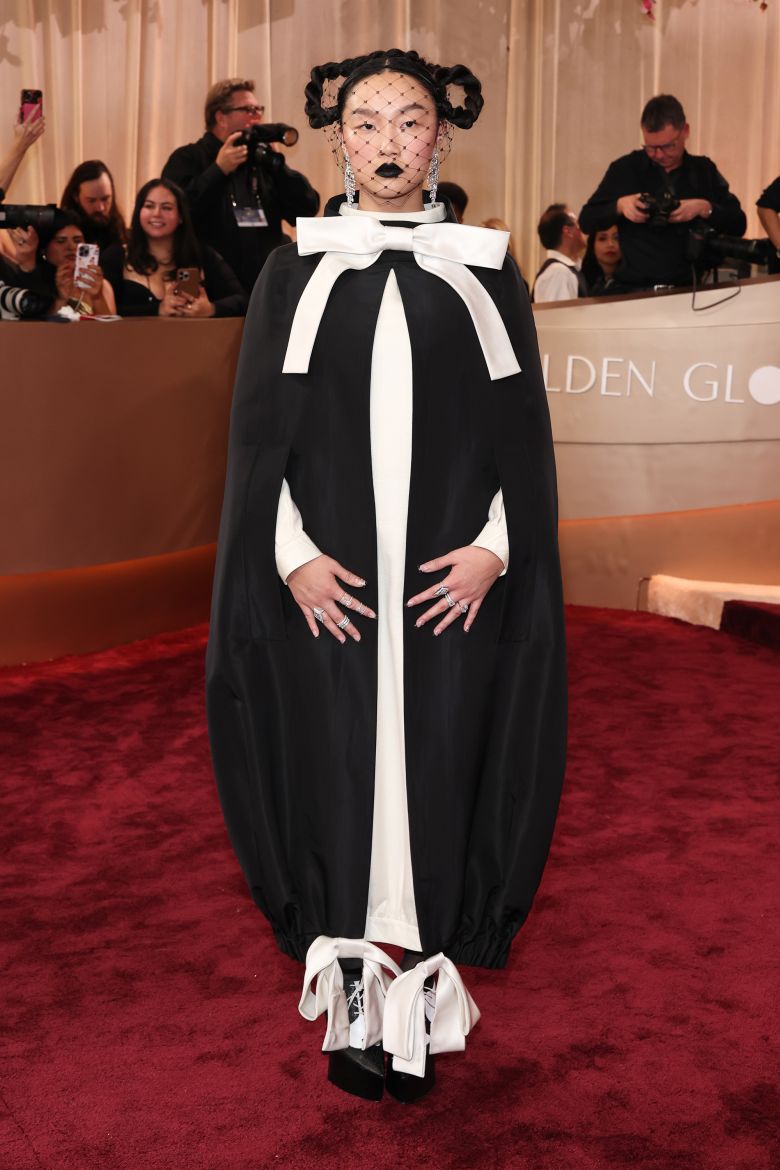 Singer Audrey Nuna opted for Thom Browne, giving the Fall-Winter 2024 runway look a gothic twist with a sweep of black lipstick.