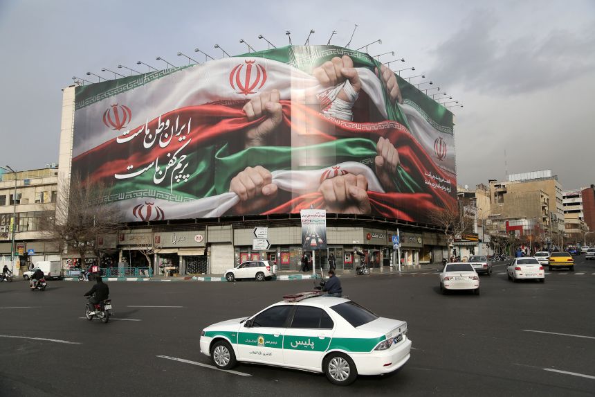 A view of giant banner featuring an image of the Iranian flag at Enghelab Square in Tehran on Thursday.