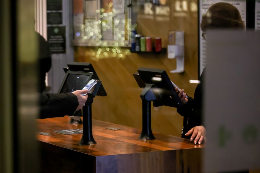 Customers at a restaurant in New York on January 14, 2026. President Donald Trump's attack on two of the biggest ways banks make money off of credit cards has Wall Street racing to come up with an olive branch, even as they gear up for a potential fight.