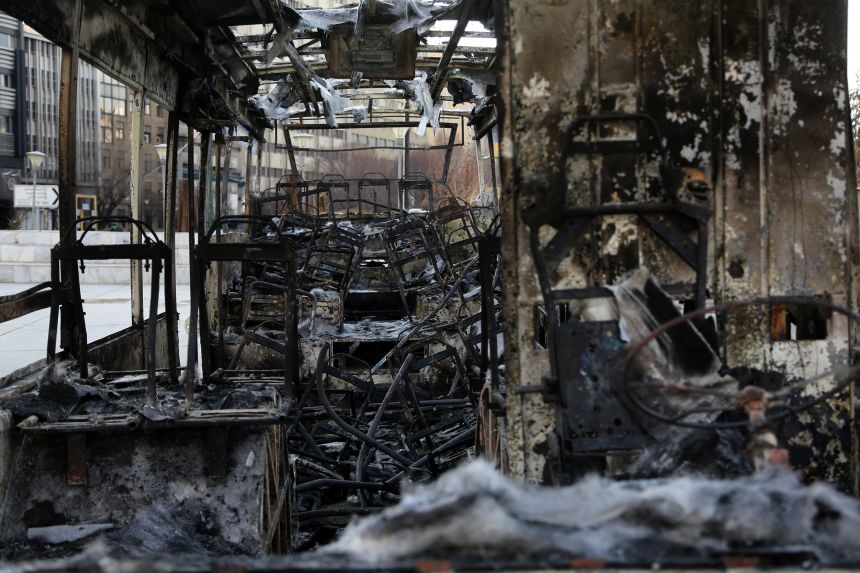 Burned municipal buses are seen in Tehran, Iran, on Thursday, following protests.