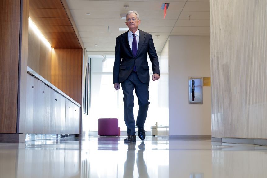Federal Reserve Chair Jerome Powell walks between meetings at the Fed on January 13, 2026 in Washington, DC.