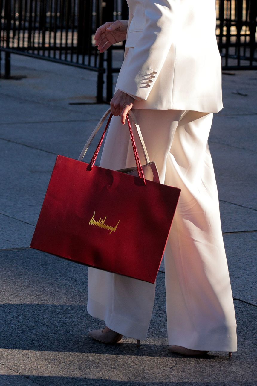 María Corina Machado carries a gift bag with President Donald Trump's signature on it outside the White House on Thursday.