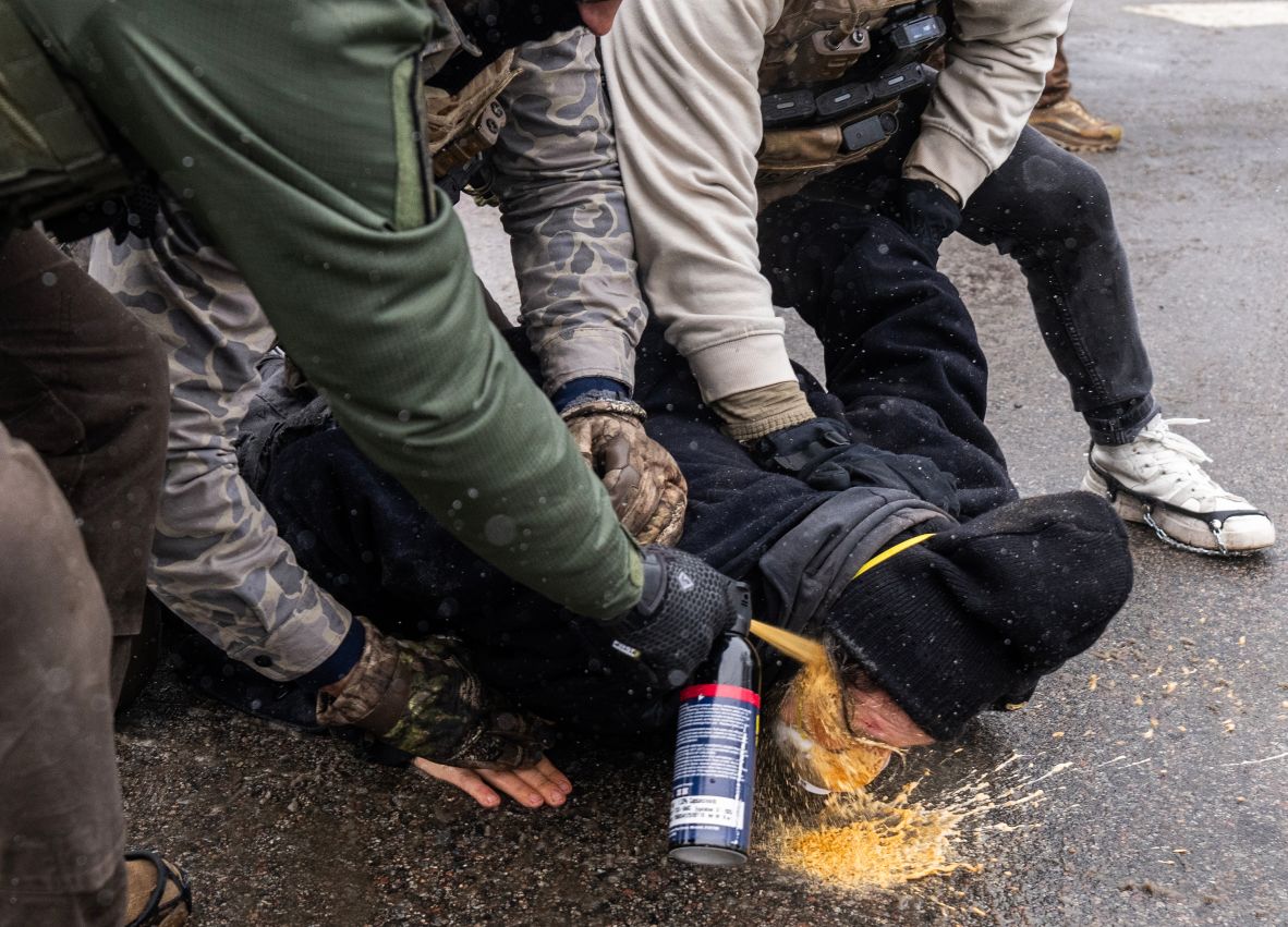 A protester was pinned to the ground by federal agents and a chemical irritant was sprayed directly into his face, Wednesday, January 21, 2026, in south Minneapolis, Minn. Protesters gathered in the area after federal agents detained two individuals, according to witnesses.