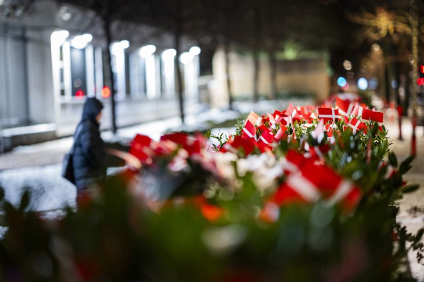 A growing number of Danish flags are placed in front of the US Embassy on Wednesday in Copenhagen after staff removed flags on Tuesday afternoon.