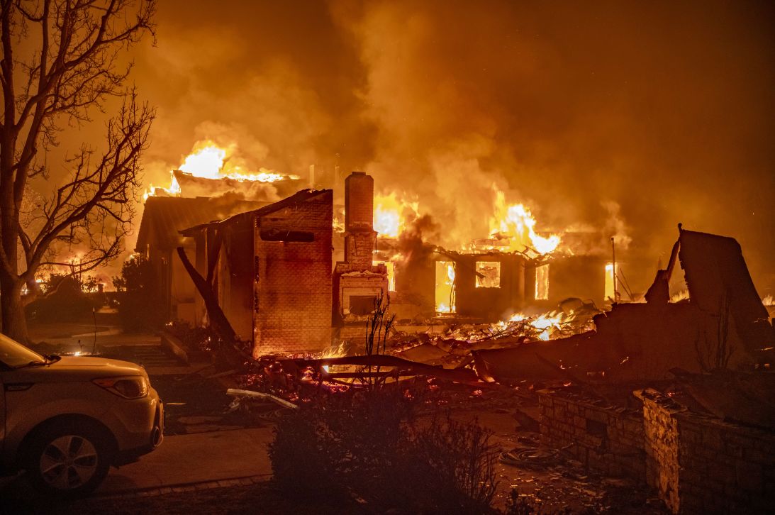 The Palisades Fire destroys homes in January 2025.