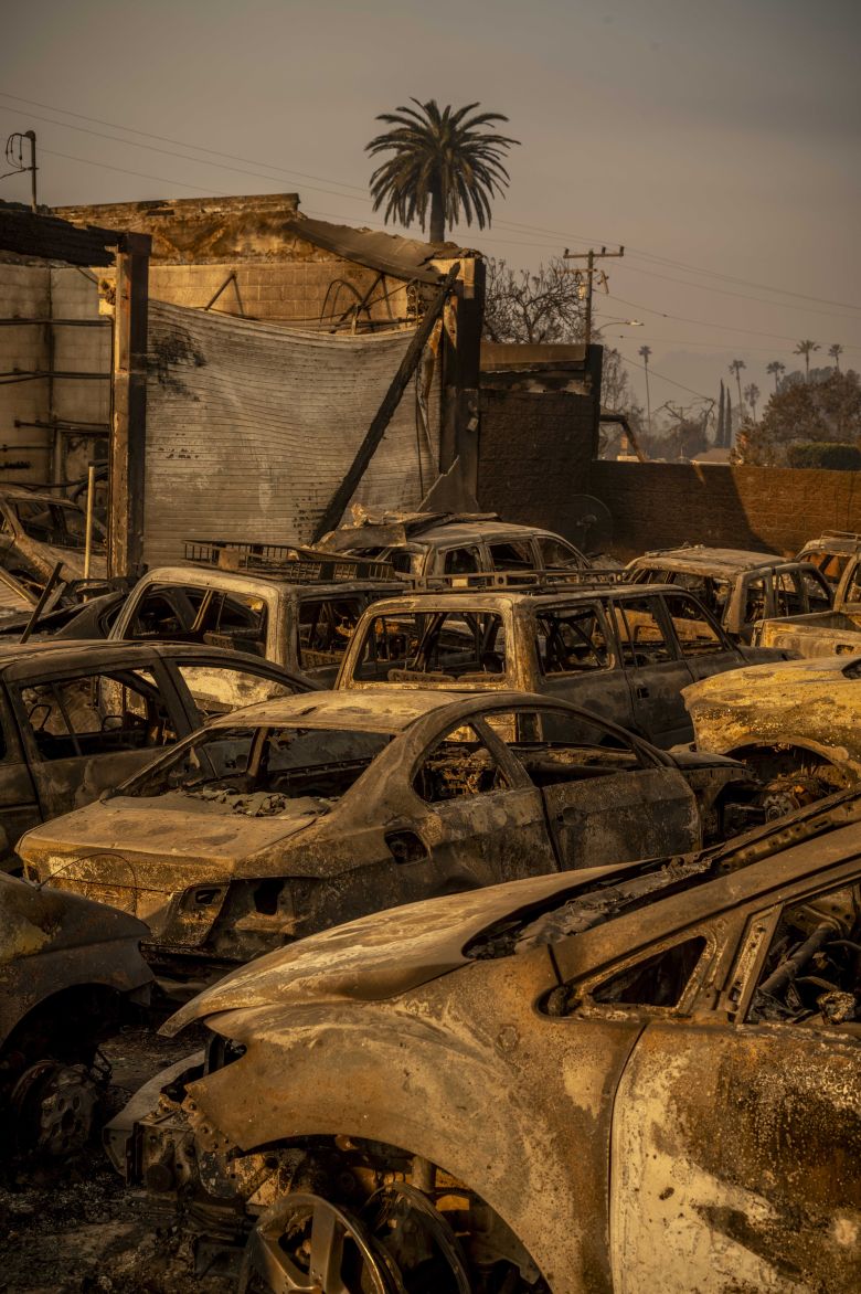 Burned-out cars are seen in Altadena in the immediate aftermath of the fire.