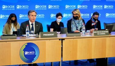 Antony Blinken, then US secretary of state, sits next to OECD official Silvia da Rin Pagnetto at a table during an OECD ministerial council meeting in Paris in 2021.