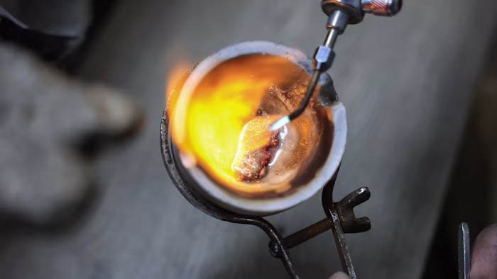 Gold climbs to record high after slide in dollar