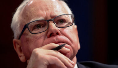 Tim Walz listens during a House Oversight Committee hearing in June 2025