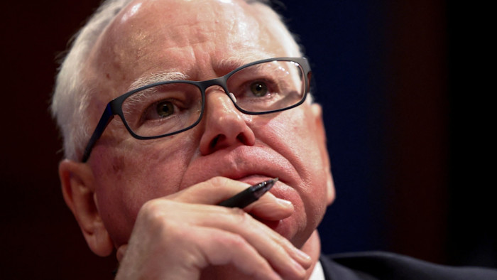 Tim Walz listens during a House Oversight Committee hearing in June 2025