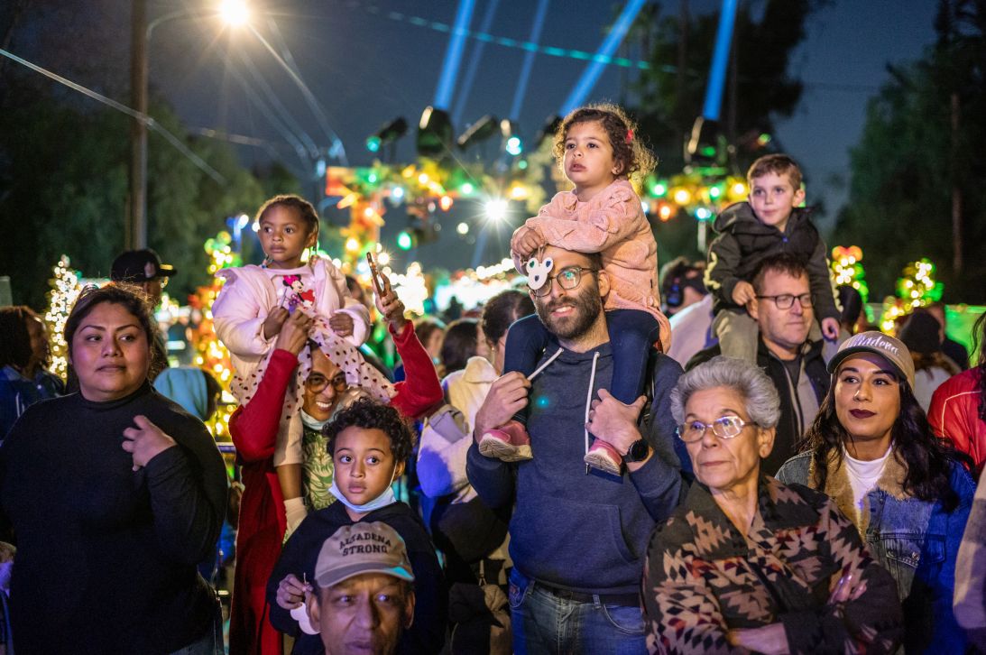 People attend the lighting of Christmas Tree Lane in Altadena, an event that brought the community together.