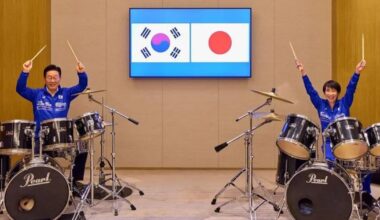 Japanese and South Korean leaders bang out surprise K-pop drum duet