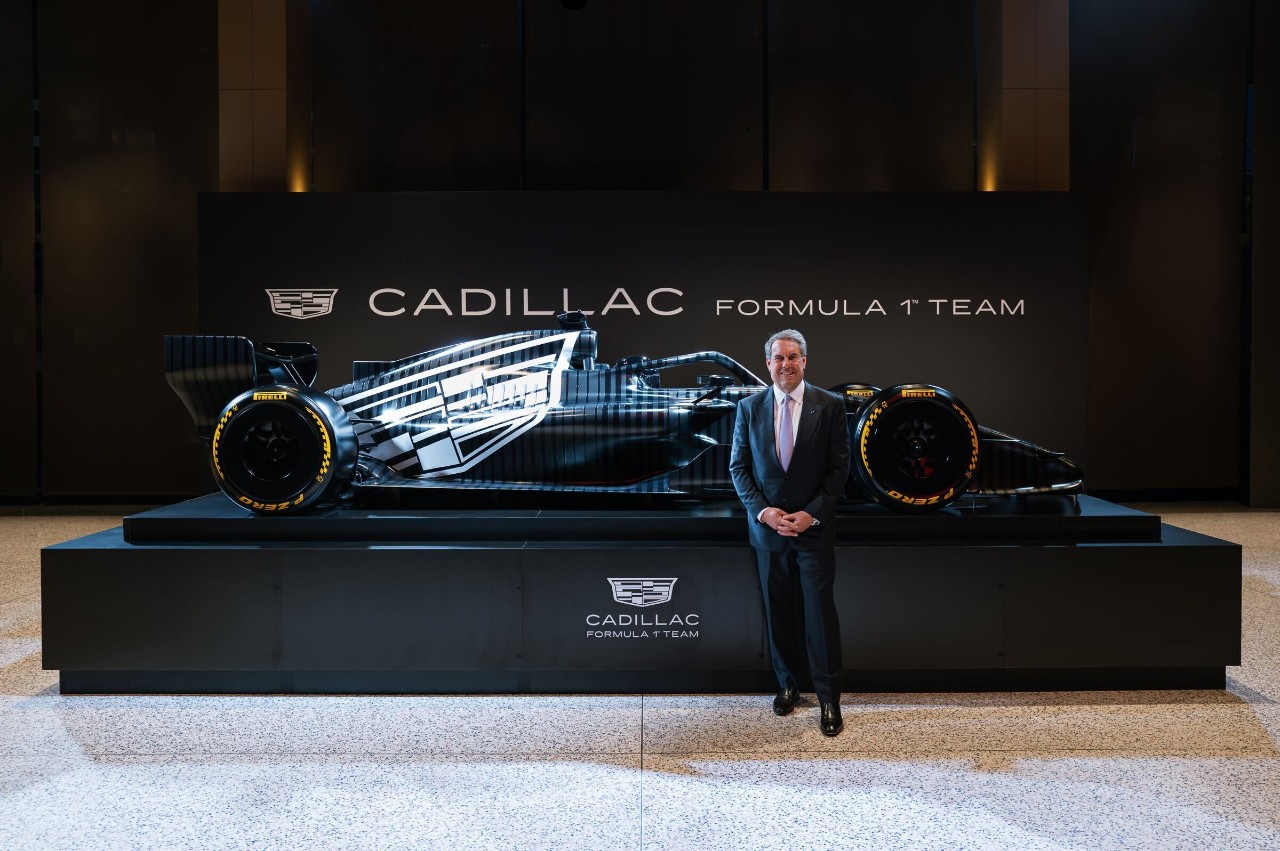 mark-reuss-and-a-car-with-the-cadillac-formula-1-test-livery Front three-quarter view of Cadillac Formula 1 test livery.