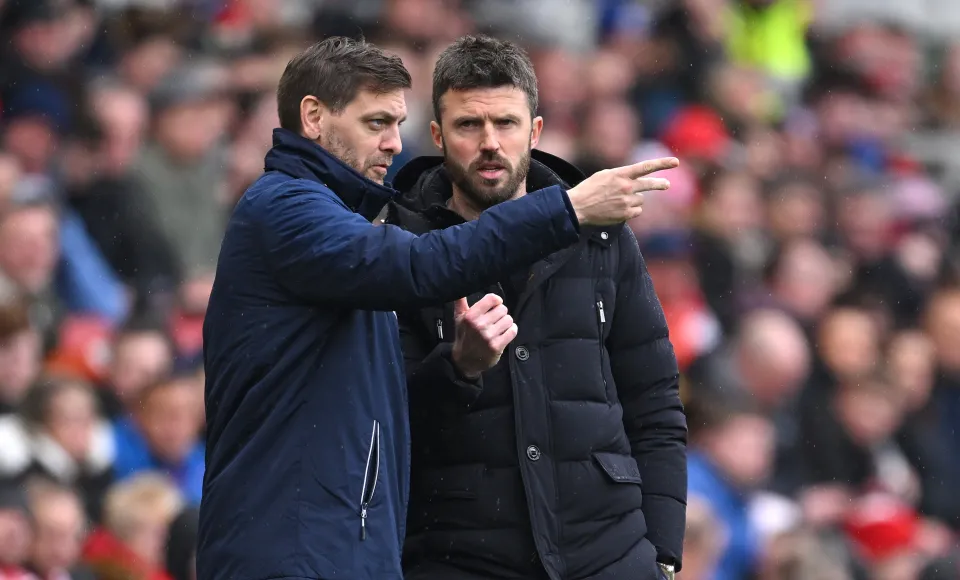 Middlesbrough head coach Michael Carrick (r) in discussion with assistant Jonathan Woodgate during the Sky Bet Championship match between Middlesbrough and Sheffield Wednesday at Riverside Stadium on April 01, 2024 in Middlesbrough, England