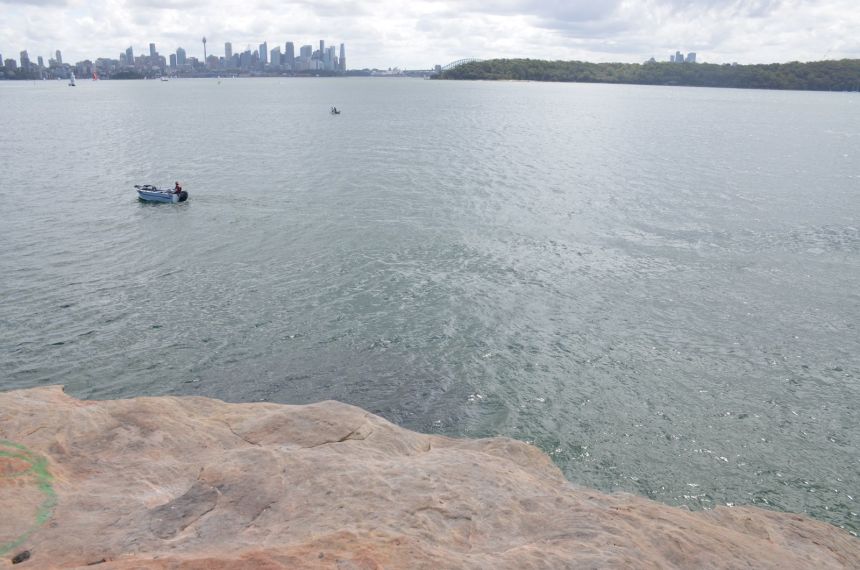 The rock ledge where a 12-year-old boy and his friends were jumping into the water before he was attacked by a shark on Sunday.