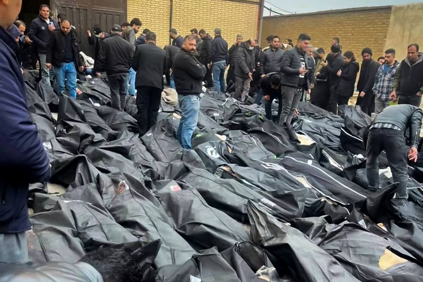 Iranians search for their loved ones amid rows of body bags after a crackdown against protesters.