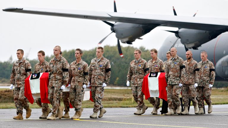 The coffins of two Danish soldiers killed Afghanistan carried out of a military plane in 2007