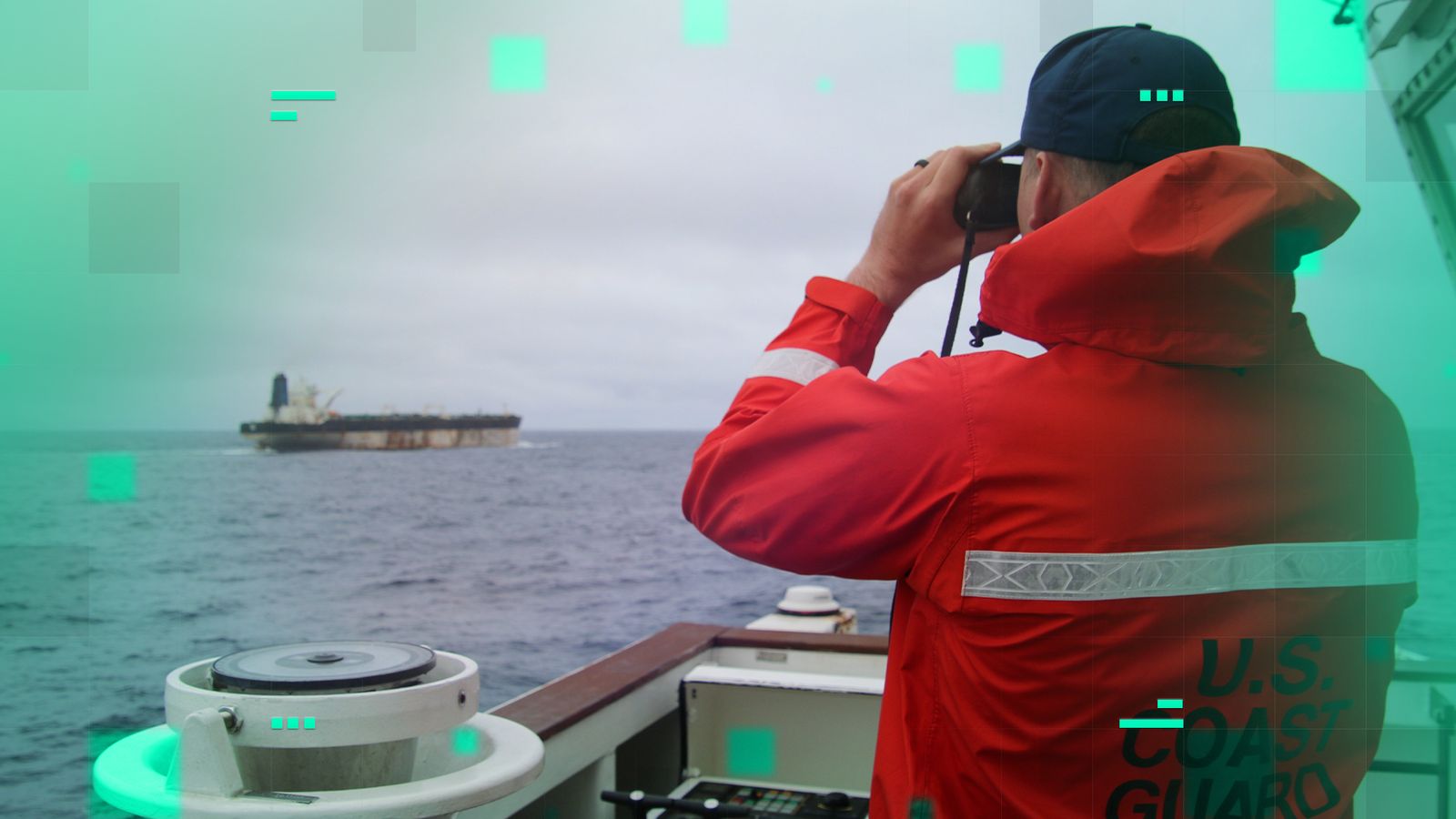 A US Coast Guard official looks through binoculars at the ship Marinera. Pic: US European Command