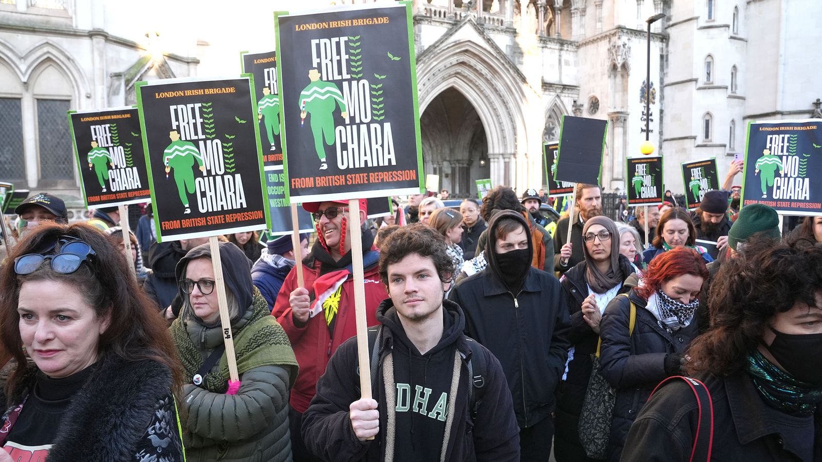 Supporters of the Irish rap group Kneecap outside the High Court. Pic: PA