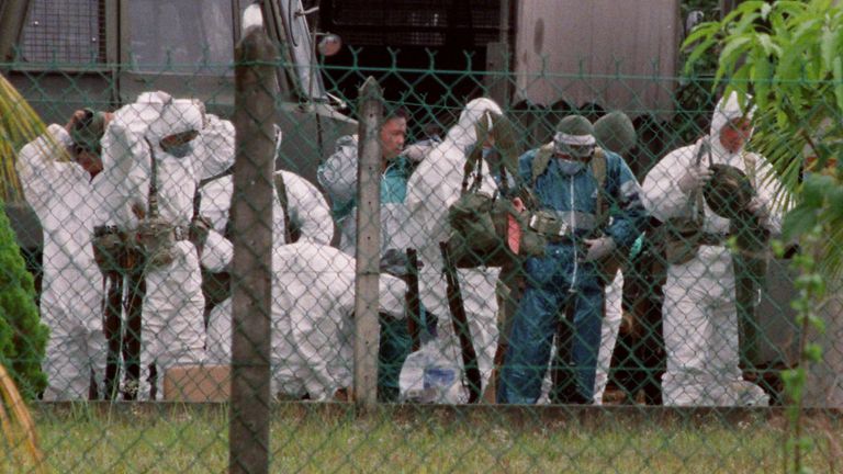 Malaysian soldiers react to the virus outbreak in 1999. Pic: Reuters