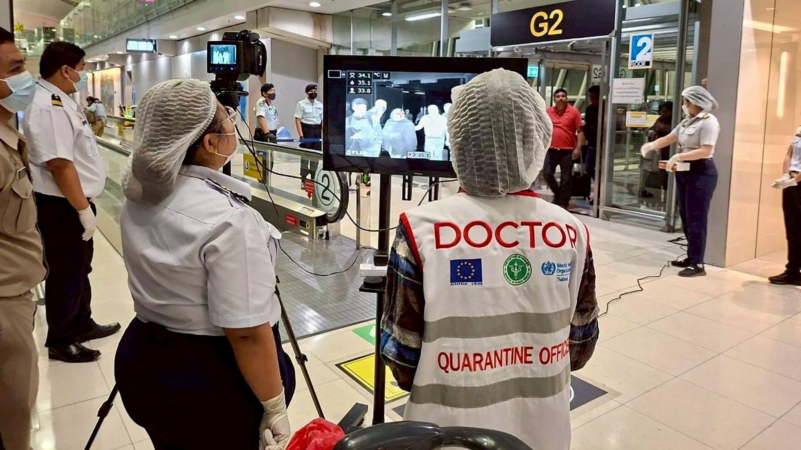 Health authorities wearing protective clothing at Suvarnabhumi International Airport in Bangkok. Pic: Reuters