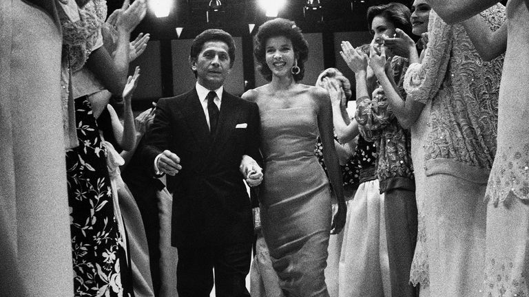 Valentino surrounded by models in Rome in 1985. Pic: AP