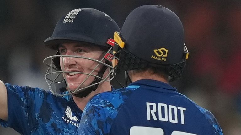 England's captain Harry Brook celebrates his century as Joe Root watches during the third ODI cricket match between England and Sri Lanka 