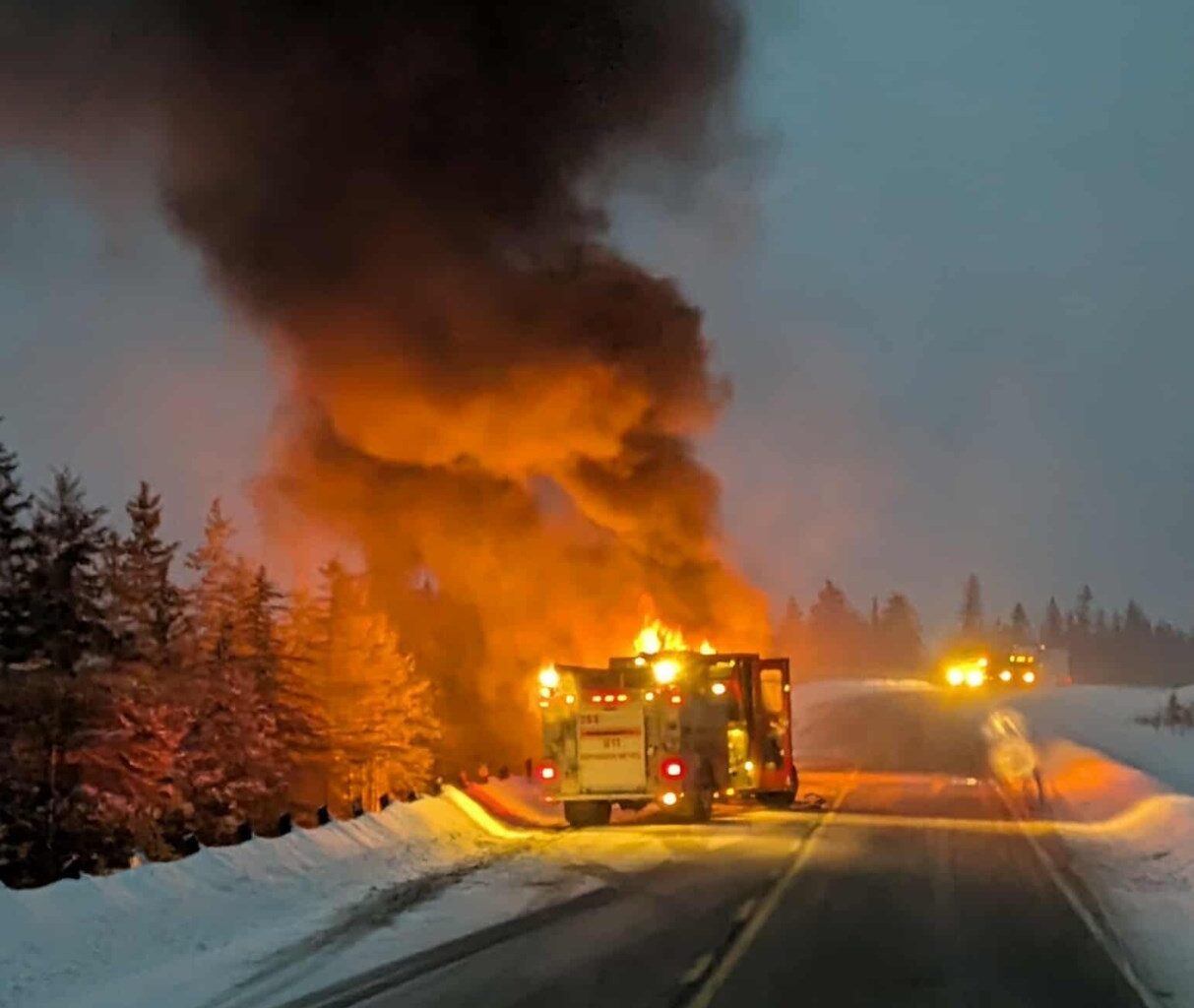 A snowplow truck caught fire on Highway 11
