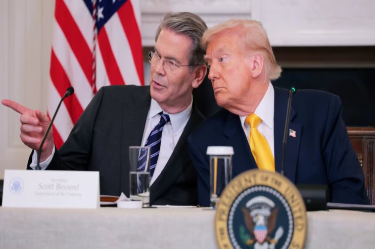 Donald Trump and Bessent in discussion at a public event, highlighting key political and business interactions