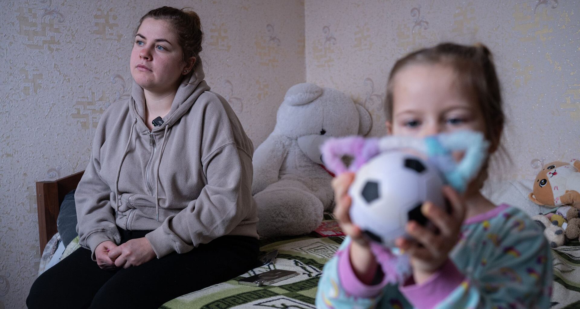 Daria and her daughter Taia are seen in their apartment in Kyiv, Ukraine, on Jan. 27, 2026.